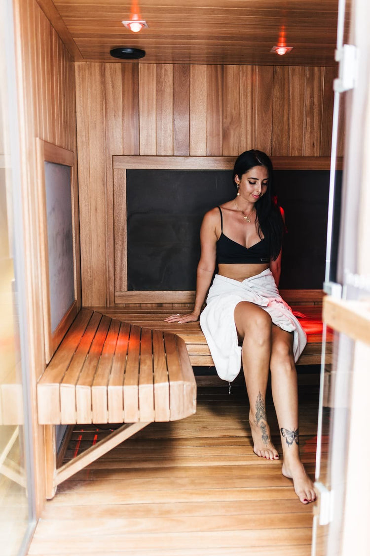 Attractive Woman Sitting in Infrared Sauna
